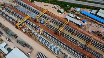 Aerial view of a cement bridge under construction. Road currently under construction at several levels to increase traffic video