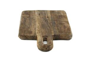 Wooden cutting board with a handle isolated on a white background photo
