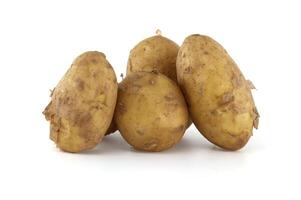 Fresh early potatoes isolated on white background photo