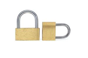 Two shiny gold padlocks isolated on white background photo