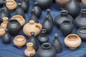 Clay vessels of different colors. Ceramics photo