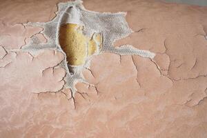 damage Leather with a cracked texture on a sofa . photo