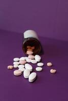 high angle view of colorful pills on color background photo