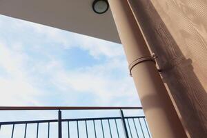 Viewing modern architectural elements from a low angle against a blue sky backdrop photo