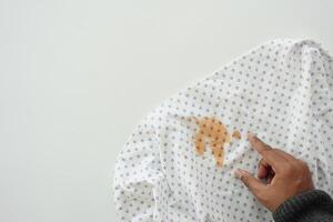 man pointing dirty cloths , showing making stain photo