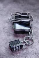 smart phone with chain lock, the concept of security for smart phone photo