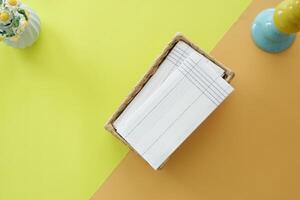 top view of tissue in a box on a color background photo