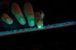 hacker hand stealing data from digital tablet photo