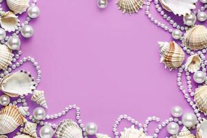 border frame template of various shells and pearls on light blue background top view with copy space photo