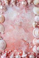 vertical border frame template of various shells and pearls on pink marble background top view with copy space photo