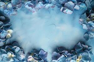 blue hydrangeas flowers border frame on light painted background top view, beautiful floral template with copy space photo