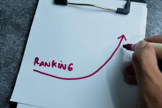 Concept of Ranking write on paperwork isolated on wooden background. photo