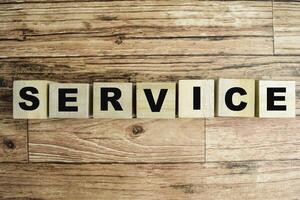 Concept of The wooden Cubes with the word Service on wooden background. photo