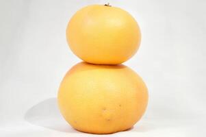 A Tower of Citrus Two Stacked Grapefruits photo