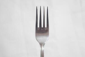A fork is shown in a close up shot photo