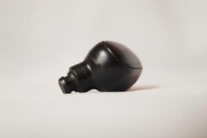 Black Wireless Earbud On White Background photo