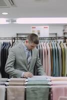 Craftsman at work in a high-end tailoring studio, measuring fabric on a classic mannequin, embodying the essence of bespoke fashion photo