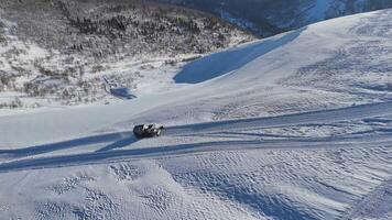 Explore snowy mountains in an offroad vehicle amidst pristine nature and breathtaking vistas video