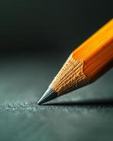 A pencil in a skilled hand sketches sharp outlines, fills them with shade, and crafts a solid, striking image photo