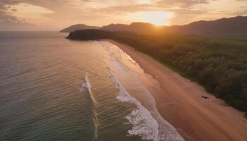 A beautiful sunset over a beach with a calm ocean. The sky is filled with orange and pink hues, creating a serene and peaceful atmosphere. The beach is lined with trees photo
