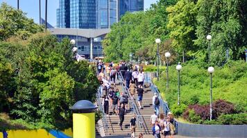 Warsaw, Poland. 8 June 2024. Crowd of people on Patelnia square in centrum city. The colloquial name. An important communication point on the city map with residents, tourists and buildings. photo