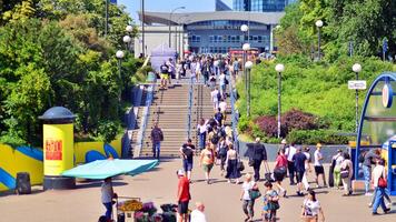 Warsaw, Poland. 8 June 2024. Crowd of people on Patelnia square in centrum city. The colloquial name. An important communication point on the city map with residents, tourists and buildings. photo