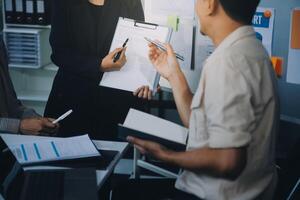 Finance manager meeting discussing company growth project success financial statistics, professional investor working start up project for strategy plan with document, laptop and digital tablet. photo