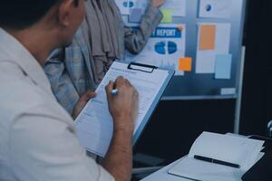 Finance manager meeting discussing company growth project success financial statistics, professional investor working start up project for strategy plan with document, laptop and digital tablet. photo