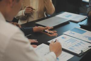 Business team collaboration discussing working analyzing with financial data and marketing growth report graph in team, presentation and brainstorming to strategy planning making profit of company. photo