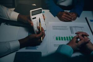 Business team meeting present, investor colleagues consultation and conference new strategy plan business and market growth on financial document graph report, Meeting and Talking. photo
