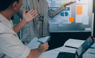 Finance manager meeting discussing company growth project success financial statistics, professional investor working start up project for strategy plan with document, laptop and digital tablet. photo