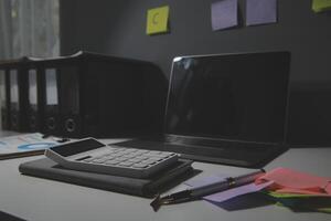 Studio workspace with laptop computer and office supplies. Work from home. With copy space photo
