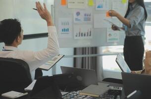Business team collaboration discussing working analyzing with financial data and marketing growth report graph in team, presentation and brainstorming to strategy planning making profit of company. photo