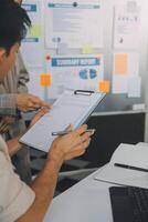 Finance manager meeting discussing company growth project success financial statistics, professional investor working start up project for strategy plan with document, laptop and digital tablet. photo