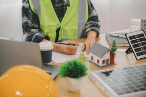 Wind energy engineer designing and developing project for residential district photo