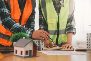 Wind energy engineer designing and developing project for residential district photo