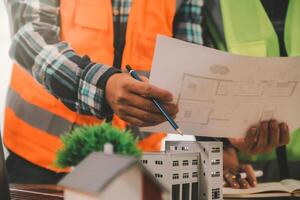Wind energy engineer designing and developing project for residential district photo