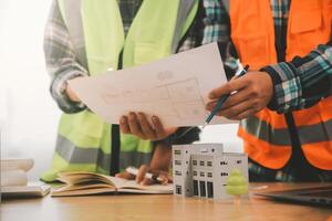 Wind energy engineer designing and developing project for residential district photo