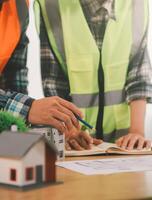 Wind energy engineer designing and developing project for residential district photo