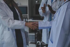 The medical team joins hands and works togetherGroup of scientists joining hands to create experimental works that meet their goals or the success of the trials that have been completed photo