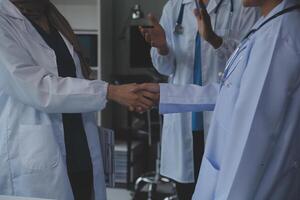 The medical team joins hands and works togetherGroup of scientists joining hands to create experimental works that meet their goals or the success of the trials that have been completed photo