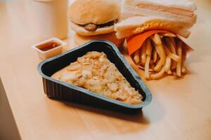 Multiple type of Fast food on table. photo