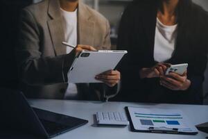 Team of business people working together in the meeting room office, teamwork background charts and graphs banner, double exposure successful teamwork,business planning concept. photo