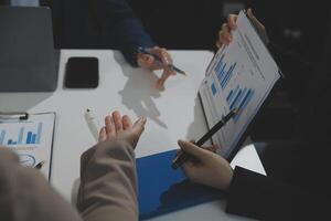 Business team collaboration discussing working analyzing with financial data and marketing growth report graph in team, presentation and brainstorming to strategy planning making profit of company. photo