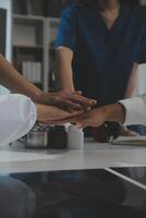 Doctor handshake and partnership in healthcare, medicine or trust for collaboration, unity or support.Team of medical experts shaking hands in teamwork for or success in hospital photo