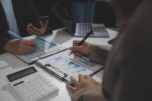Business team collaboration discussing working analyzing with financial data and marketing growth report graph in team, presentation and brainstorming to strategy planning making profit of company. photo