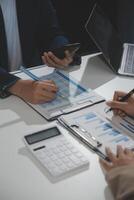 Business team collaboration discussing working analyzing with financial data and marketing growth report graph in team, presentation and brainstorming to strategy planning making profit of company. photo