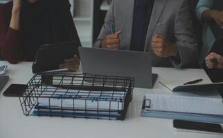 Team of business people working together in the meeting room office, teamwork background charts and graphs banner, double exposure successful teamwork,business planning concept. photo