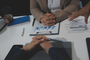 Business team collaboration discussing working analyzing with financial data and marketing growth report graph in team, presentation and brainstorming to strategy planning making profit of company. photo
