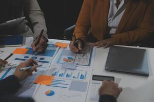 Business team collaboration discussing working analyzing with financial data and marketing growth report graph in team, presentation and brainstorming to strategy planning making profit of company. photo